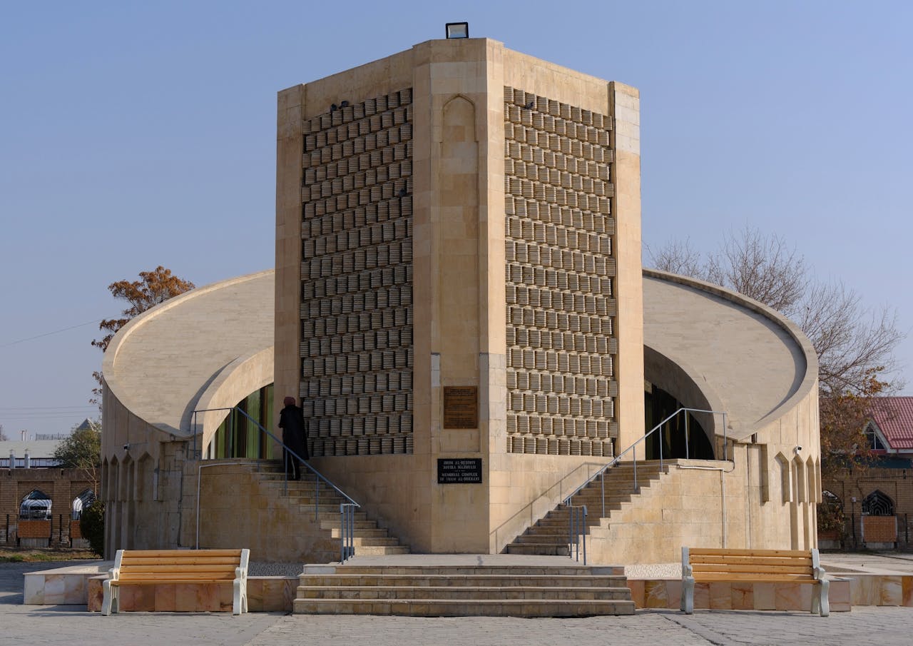 Services-01 Unique modern building with stone facade and curved design captured outdoors.